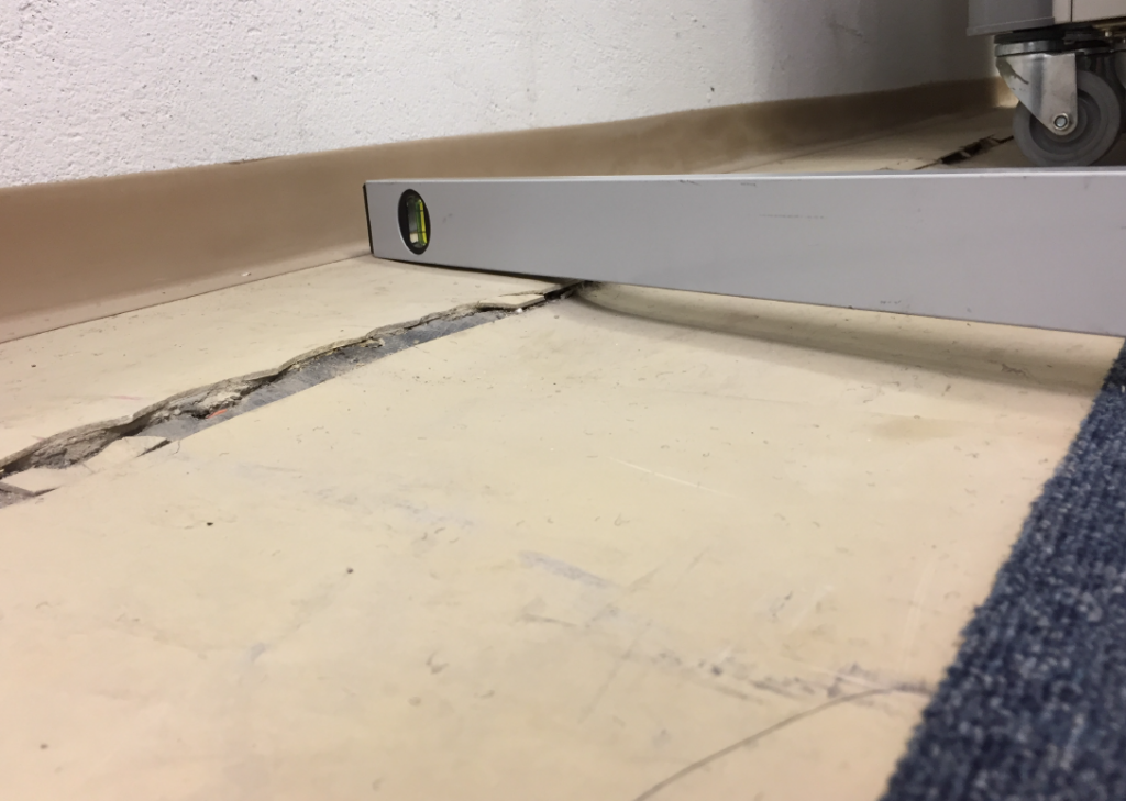 Ground movement on floor due to subsidence in educational facility